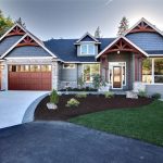 a craftsman exterior with aluminum garage doors that looks like real wood