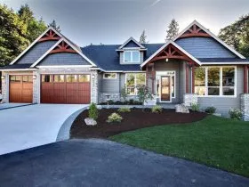 a craftsman exterior with aluminum garage doors that looks like real wood