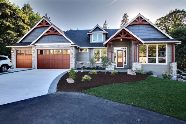 a craftsman exterior with aluminum garage doors that looks like real wood