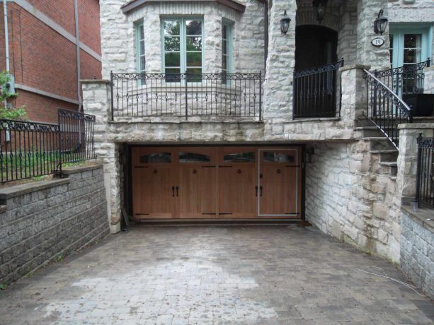 a garage in a lower position than the main entrance of the house comes with a man door for easy access
