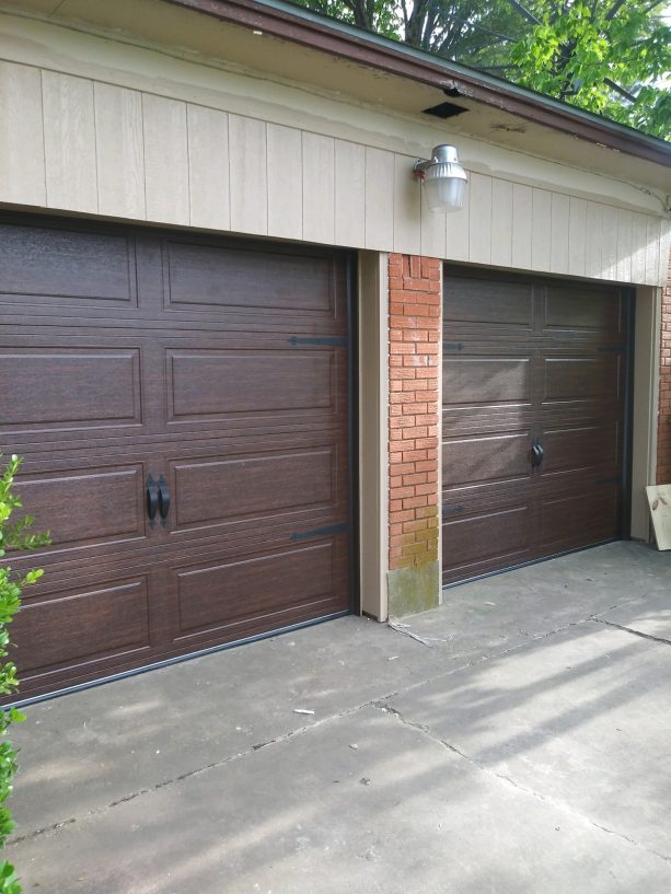 a walnut-finished modern steel garage door