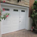 an elegant white garage door with integrated pedestrian entry and glass panels for natural light