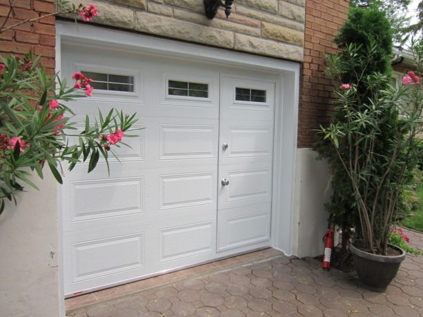 an elegant white garage door with integrated pedestrian entry and glass panels for natural light