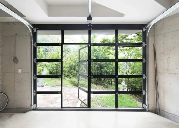 an example of glass, sectional garage door with a man door