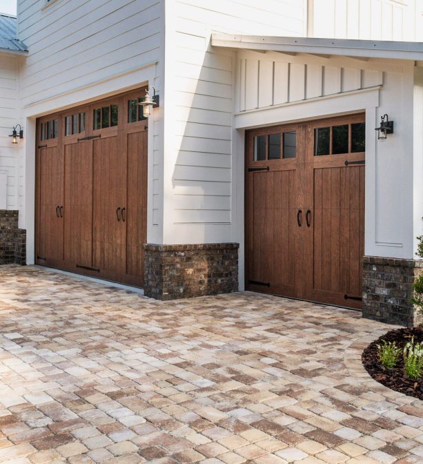 faux wood garage door with realistic look in a farmhouse exterior