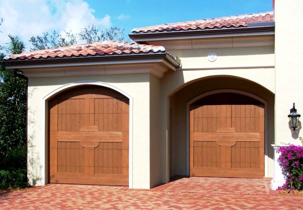 steel garage door that looks like real cedar wood in a Spanish-style home exterior