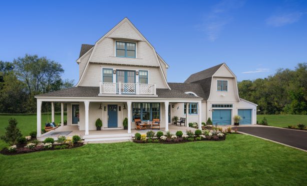 the blue garage color matches the exterior trim and front entry