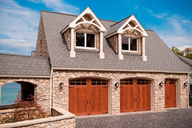 the faux wood garage doors look like real because of the grain pattern