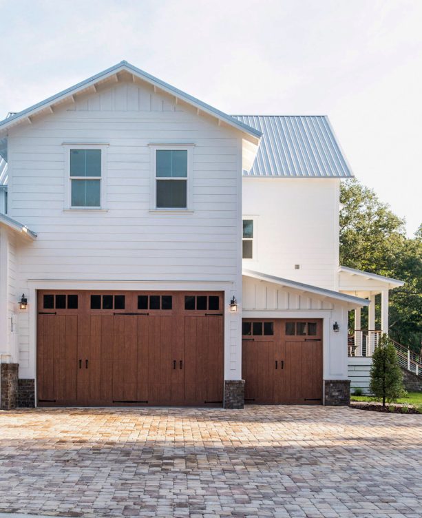 the faux wood insulated, carriage-style garage door seen from far