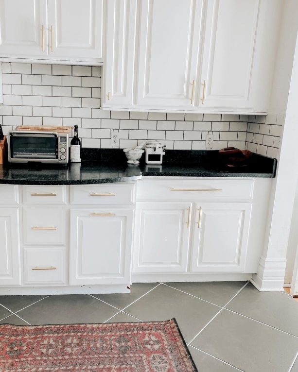 the tile floor after the makeover for a faux slate look