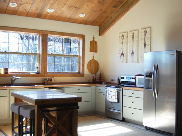 the kitchen with complete cabinetry and appliances