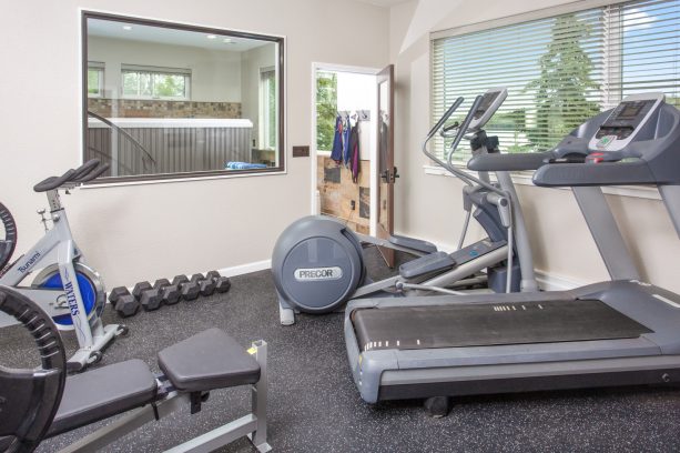 the living quarters’ gym area that is connected to a private spa next to it