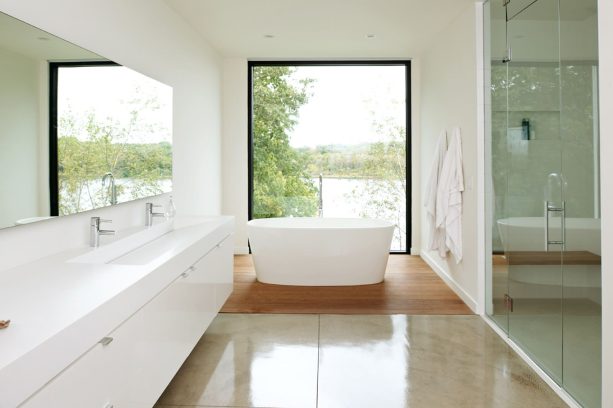 a bathroom with acrylic-sealed concrete floor and ipe wood for the bathtub area