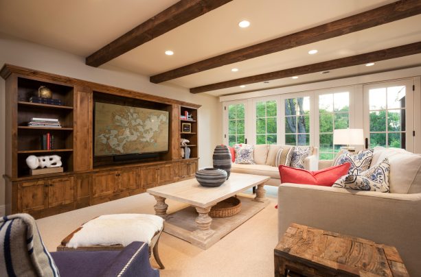 a comfortable traditional family room with beige carpet flooring
