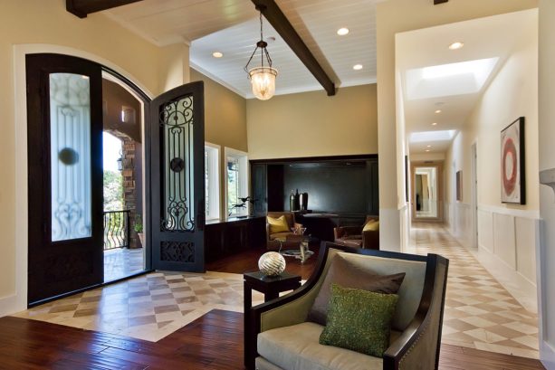 contemporary entry with the matching between dark hardwood floor and two tone diamond tile