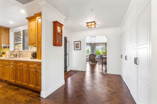 interior with herringbone floor for the hallway and strip wood pattern for the rest