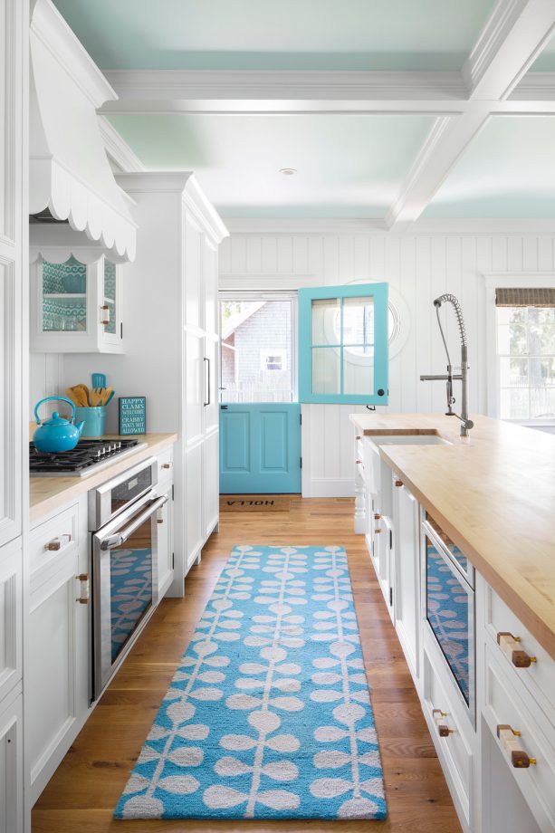 same oak wood flooring in the open-style kitchen area