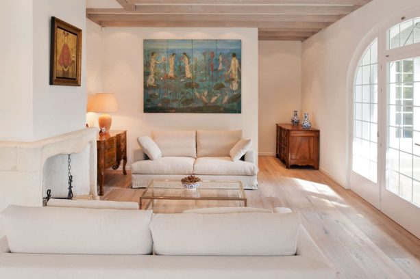 the open plan living room with the same light color wood floor