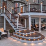 a custom outdoor stair railing with discreet post cap lighting for ambiance