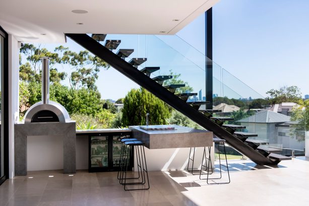 a semi outdoor-stair with seamless glass railing design