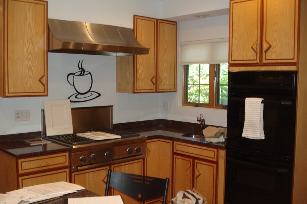 before reface - an outdated cabinet can make a kitchen looks dull too