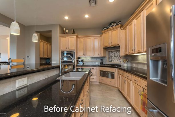 the pickled oak cabinets with mitered flat panel doors before the refacing