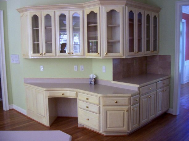 before reface - the plain-looking kitchen cabinet with light wood color