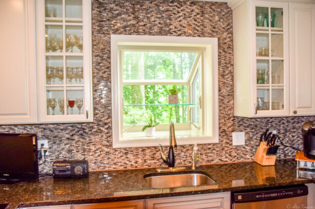 a miniature greenhouse window in an eclectic kitchen interior