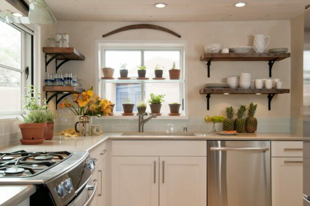 a small, yet beautiful white garden window in a U-shape eclectic kitchen
