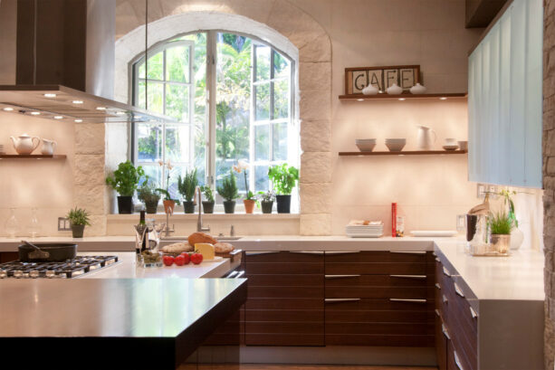 an arched, openable garden window in a contemporary kitchen