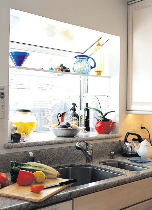 colorful, decorative kitchenware placed on the shelf of a garden window