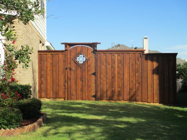 craftsman style board on board fence with wooden gate