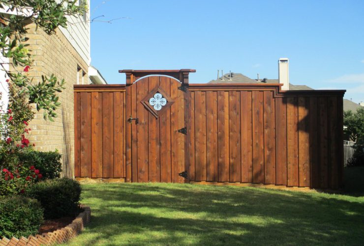craftsman style board on board fence with wooden gate