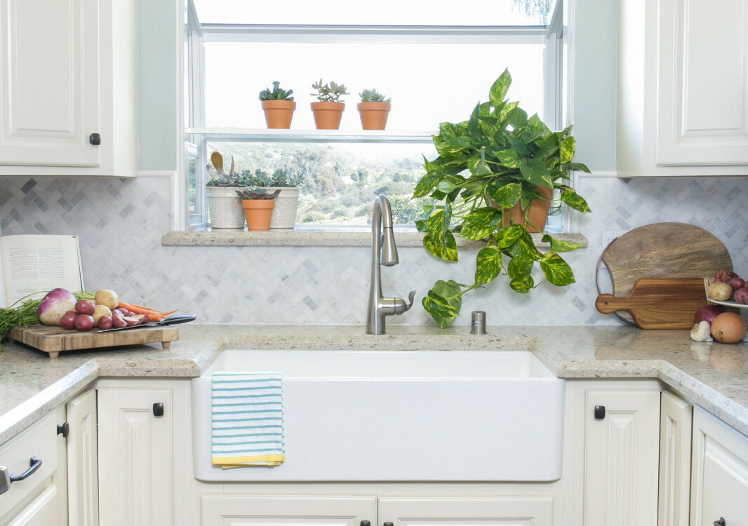 the garden window over sink allow more natural light to brighten the small U-shaped kitchen