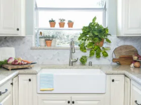 the garden window over sink allow more natural light to brighten the small U-shaped kitchen