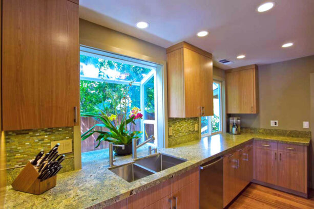 the sleek garden window look because of the uncut kitchen countertops