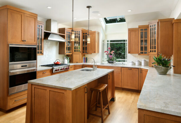 a garden window over the kitchen sink paired with a skylight on the ceiling