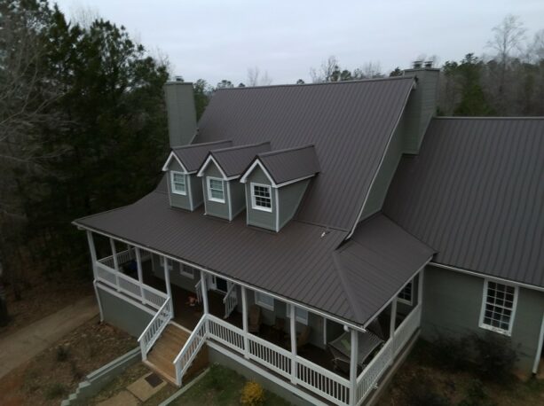 an exterior design with burnished slate metal roofing to cover its old shingles