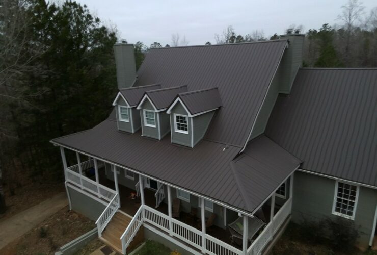 an exterior design with burnished slate metal roofing to cover its old shingles