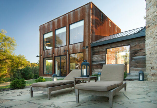 the metal burnished slate color roofing of the small hallway of a modern exterior