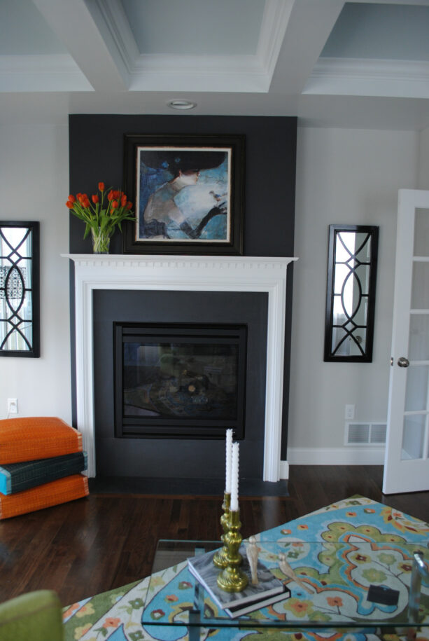 a closer look to the Gray Owl wall that is paired with the black fireplace for a classic touch